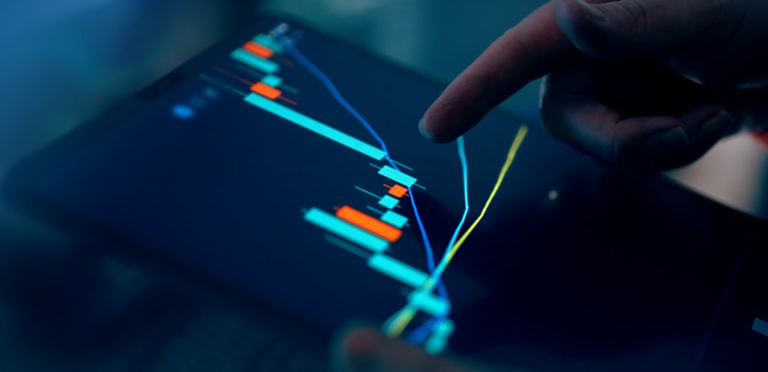 Beginner trader analyzing Forex and cryptocurrency charts on computer screens comparing market opportunities